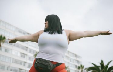 Overweight woman exercising outside