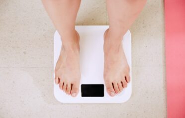 women on weighing scale
