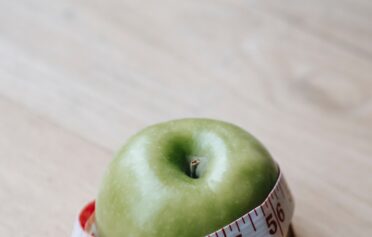 Apfel in einem Messband