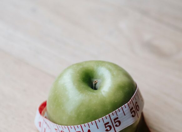 Apfel in einem Messband