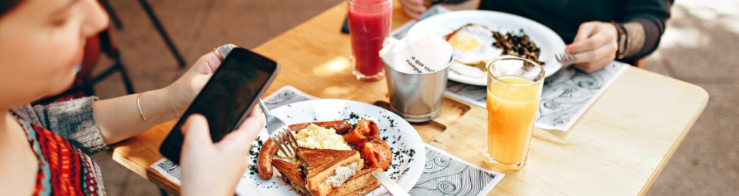 Two people eating breakfast at a restaurant