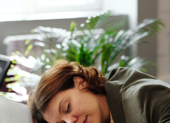 Woman sleeping on her desk