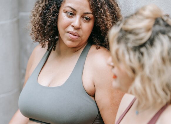 Women in sports clothing talking