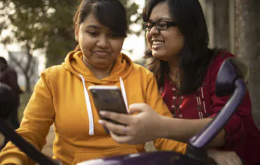 Women looking at phone together